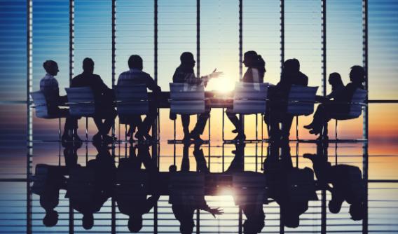 Board Members in meeting at sunrise