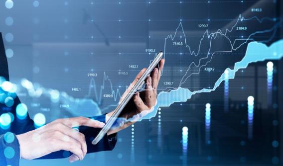 Data charts displayed over someone holding a tablet